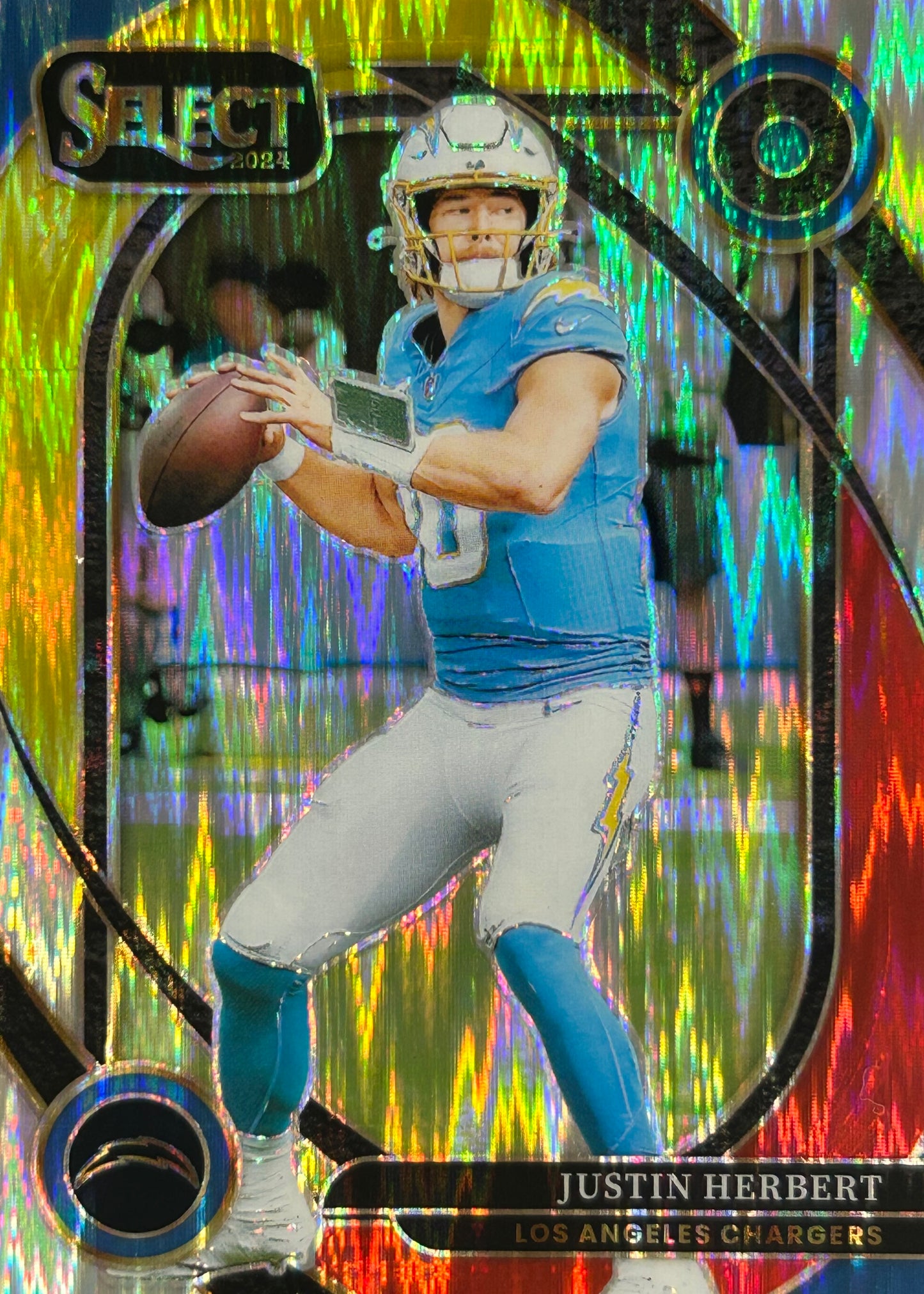 Justin Herbert Select Red Yellow Shock Chargers