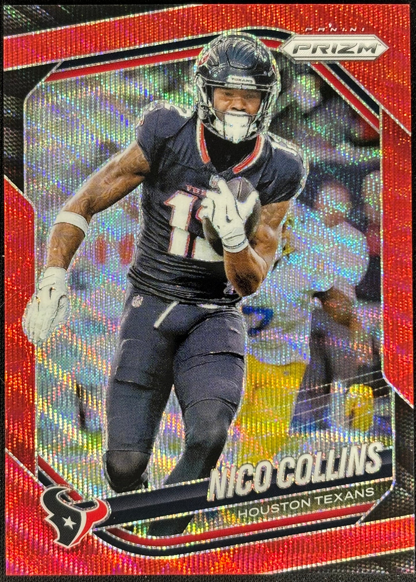Football trading card of a player in action on a black background
