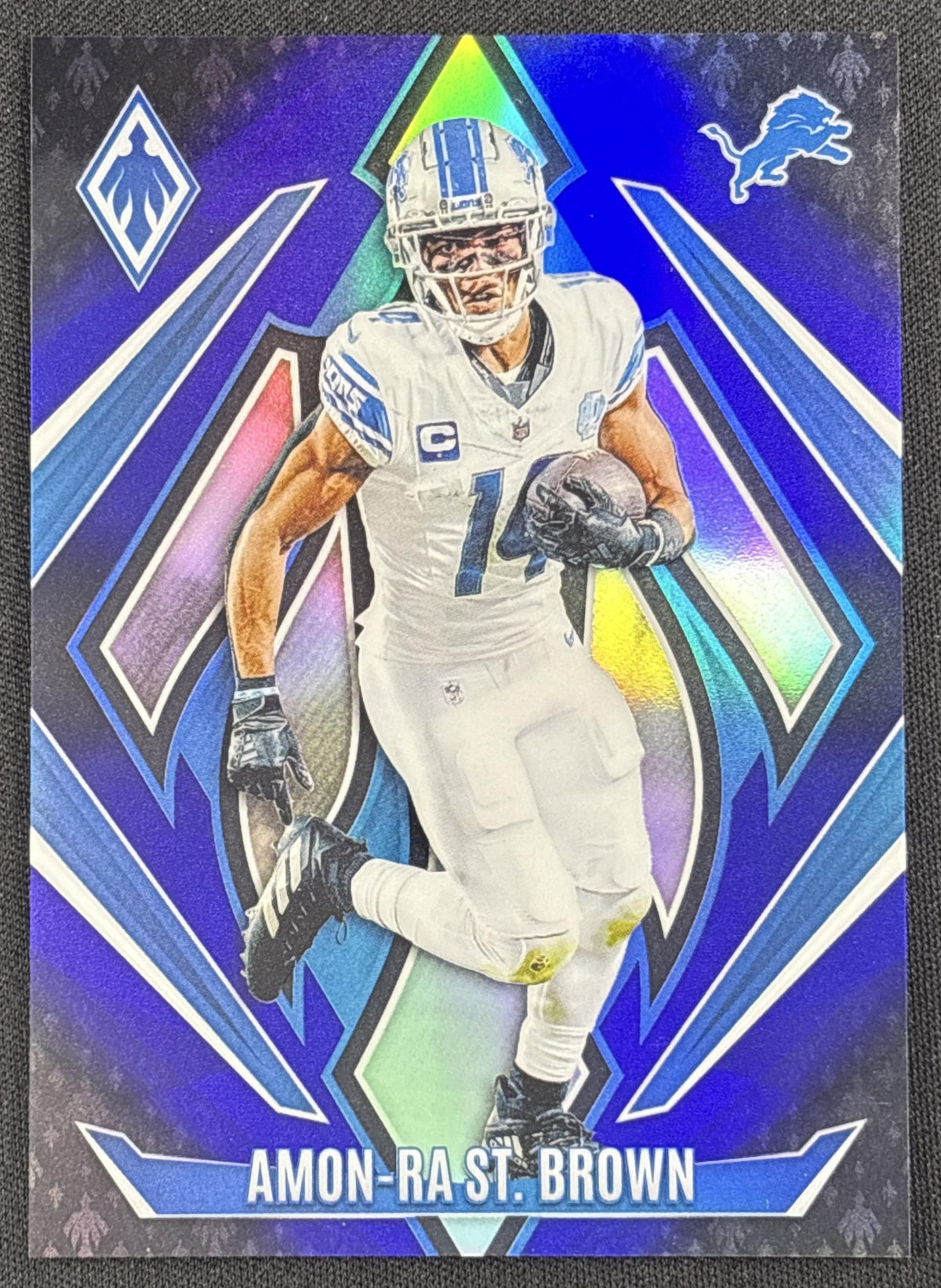 Amon-Ra St. Brown 2024 Panini Phoenix Blue Fade /249 Lions