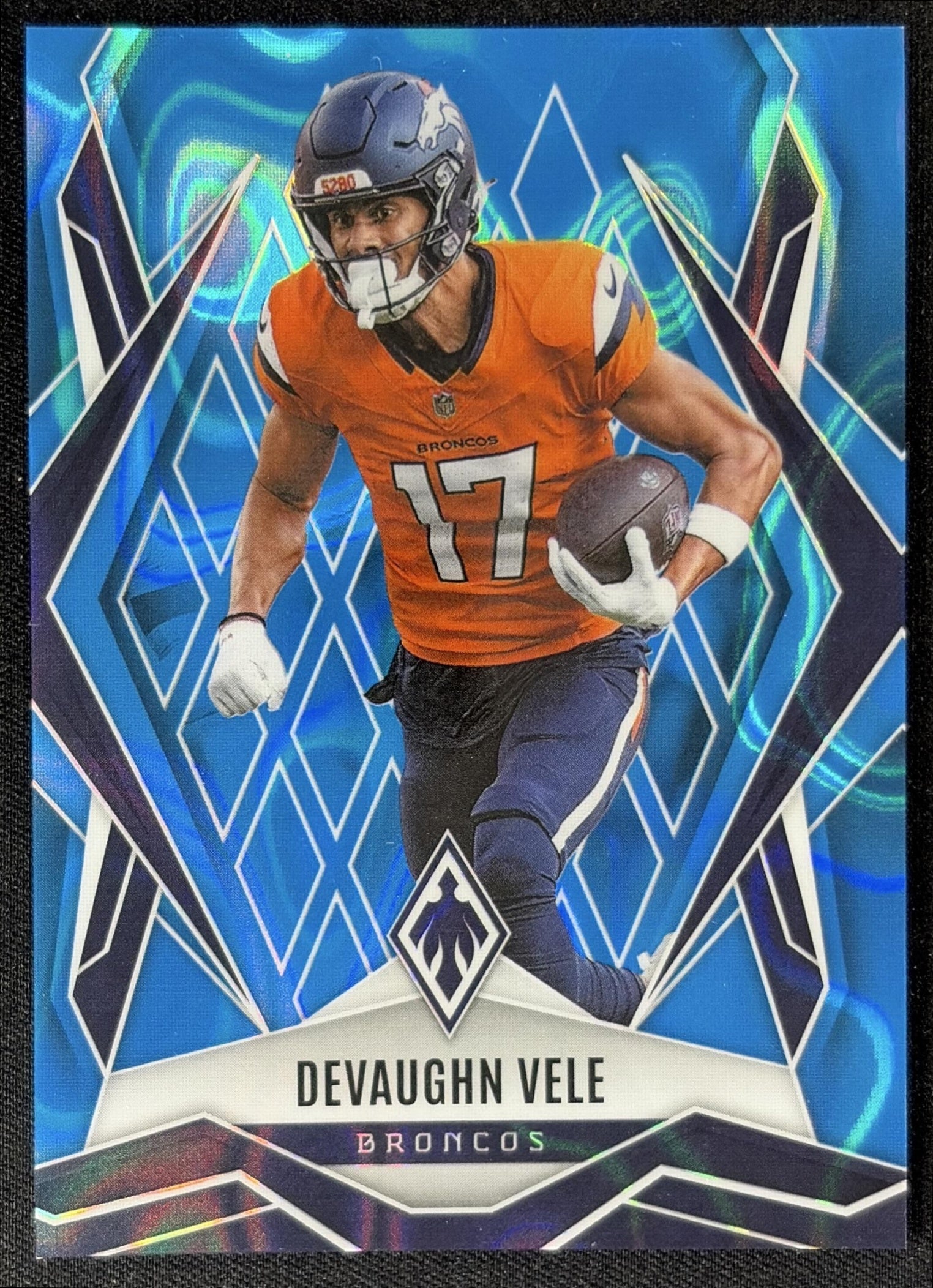 Devaughn Vele 2025 Panini Phoenix Light Blue Lava Prizm /325 Broncos