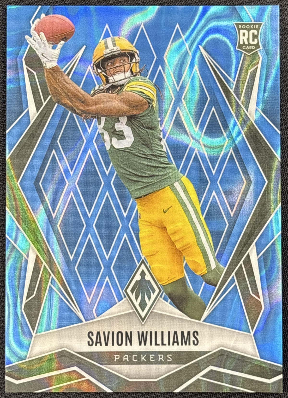 Savion Williams 2025 Panini Phoenix Light Blue Lava Prizm /325 Packers