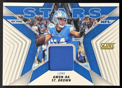 Amon-Ra St. Brown 2025 Panini Score Stars of the NFL Jersey Lions front