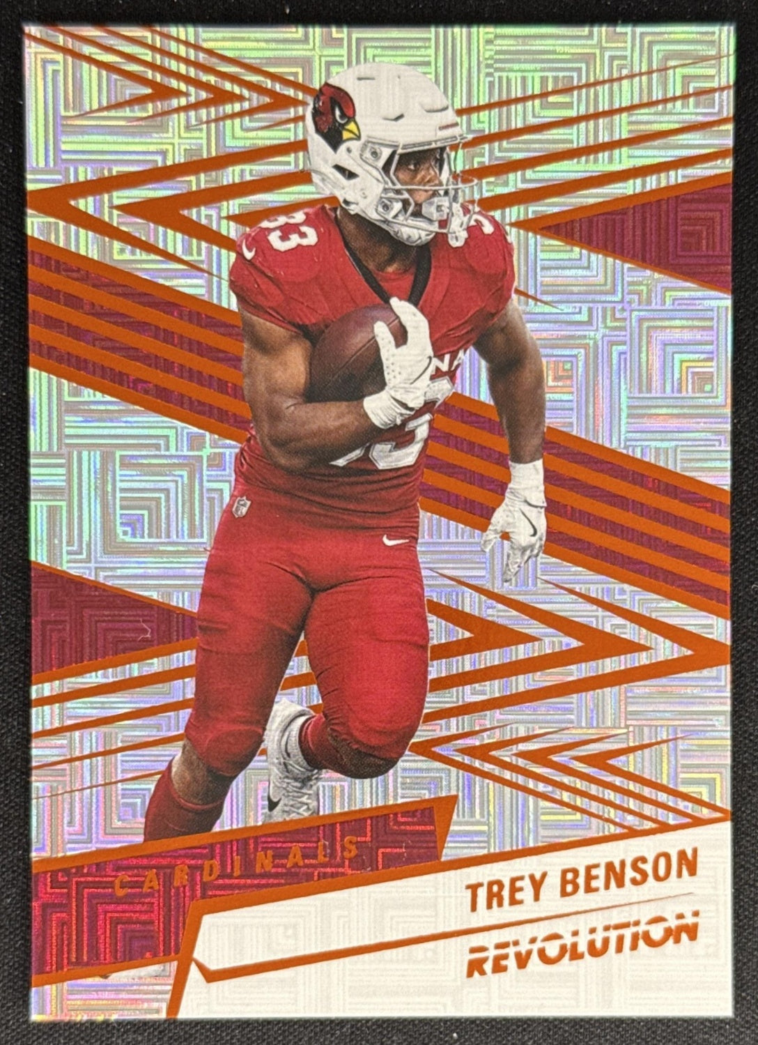 Trey Benson 2025 Panini Revolution Orange Levels /299 Cardinals Sports Trading Card