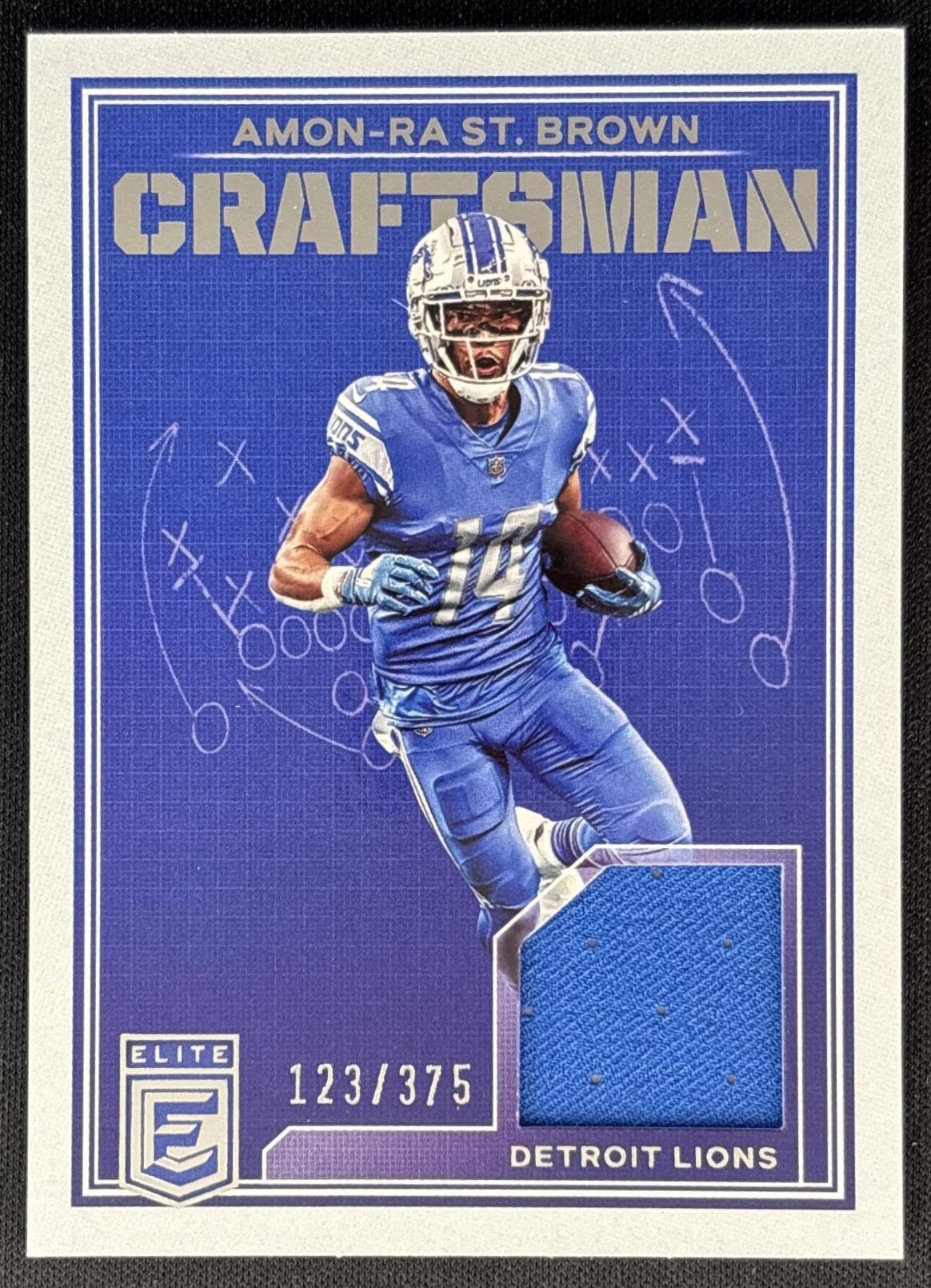 Amon-Ra St. Brown 2023 Panini Donruss Elite Craftsman Jerseys /375 Lions front