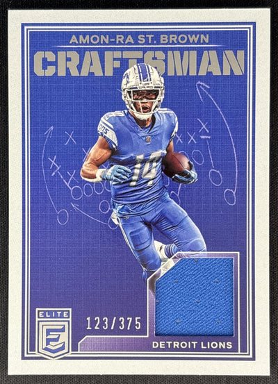 Amon-Ra St. Brown 2023 Panini Donruss Elite Craftsman Jerseys /375 Lions front