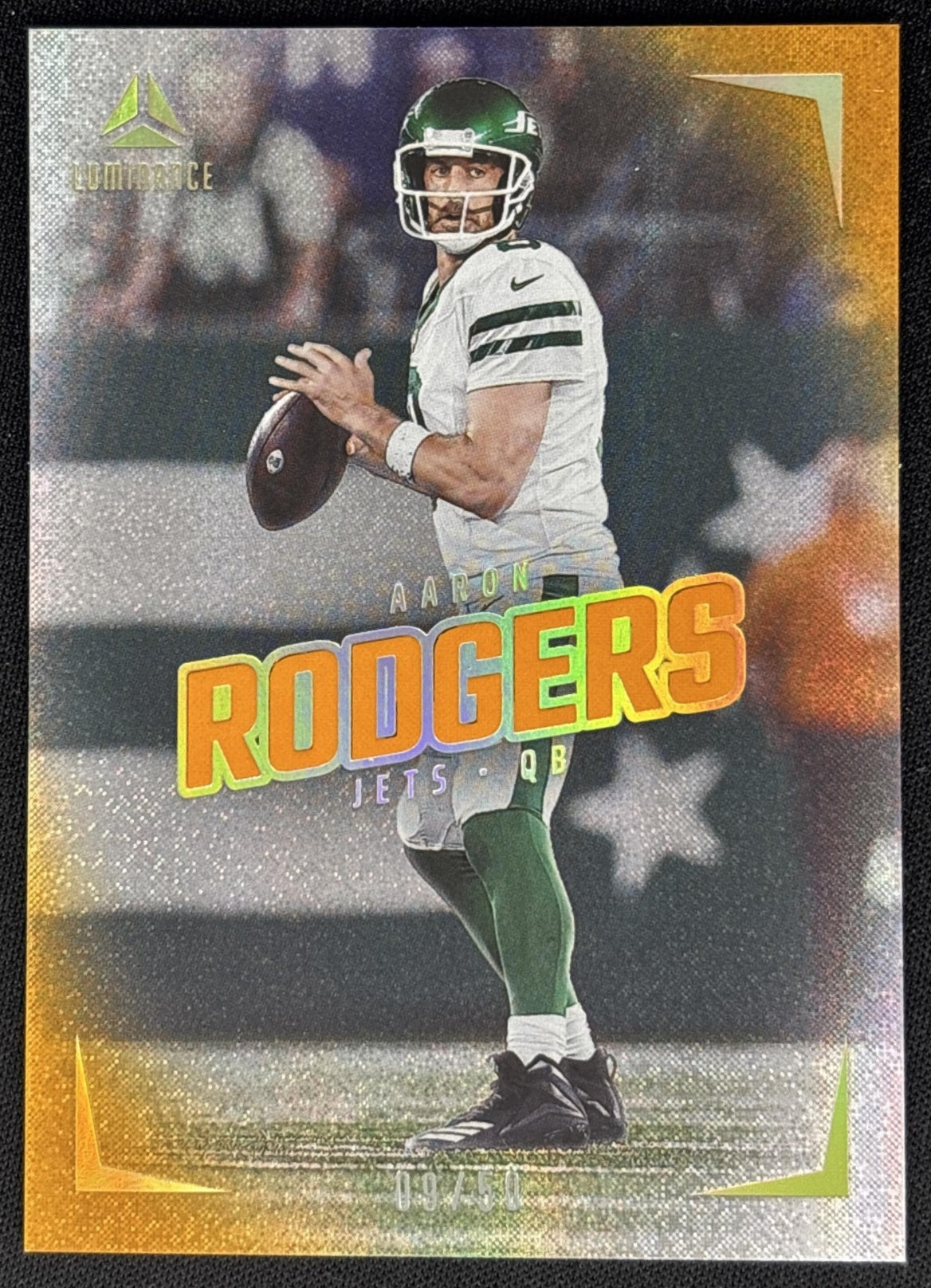 Aaron Rodgers 2024 Panini Luminance Orange /50 Jets