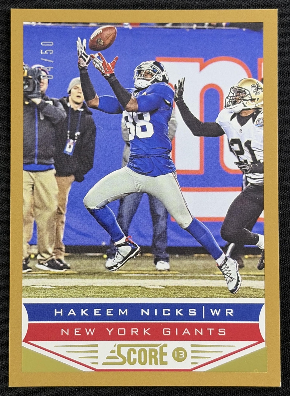Front of Hakeem Nicks 2013 Panini Score Gold Zone /50 Giants sports trading card