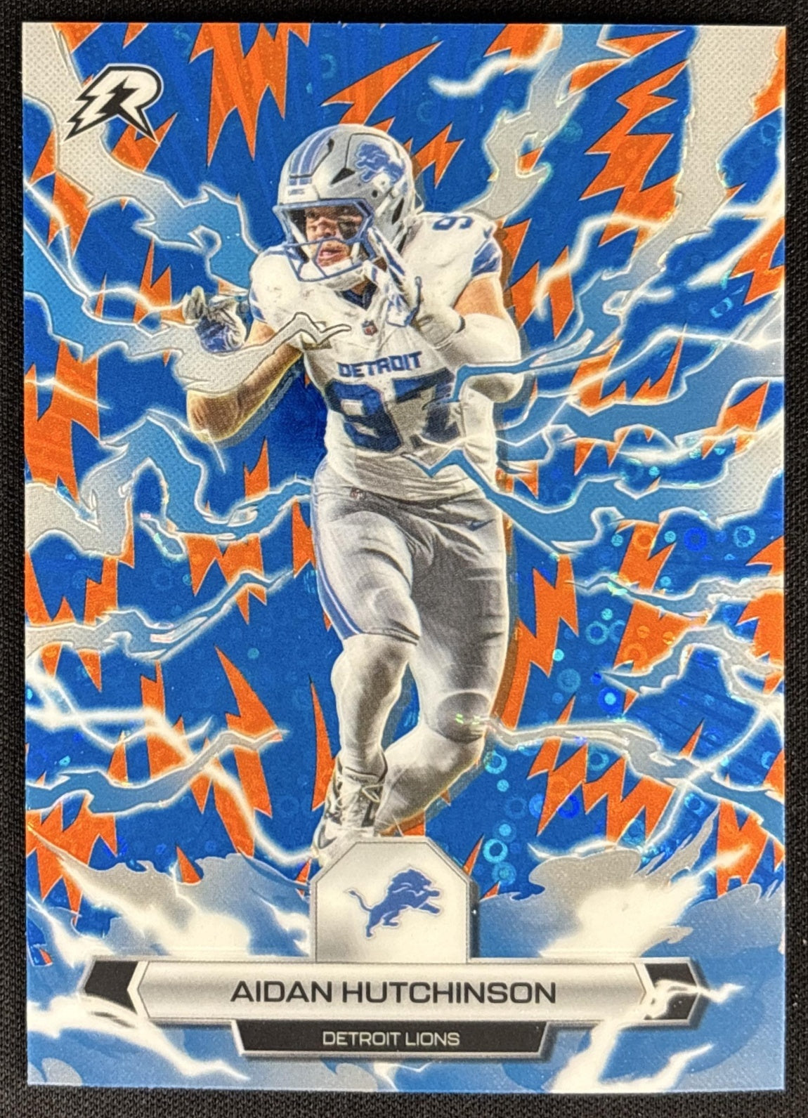 Aidan Hutchinson 2025 Topps Resurgence Blue and Orange Spark Refractor Lions