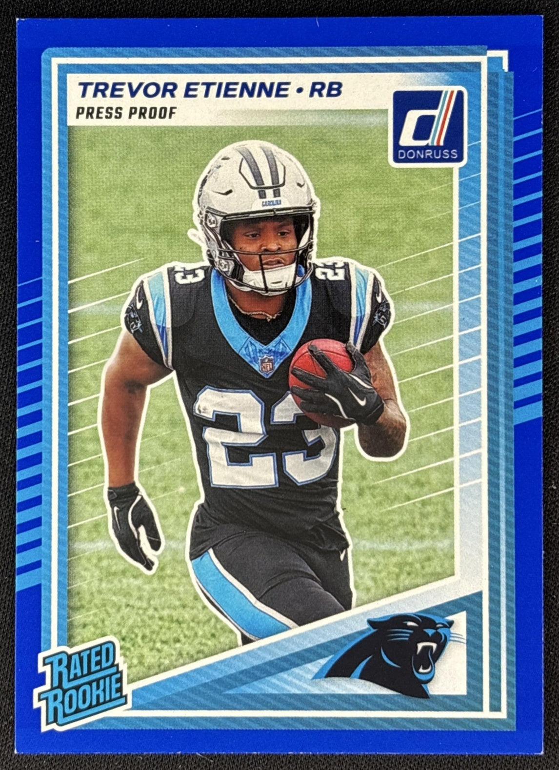 Trevor Etienne 2025 Panini Donruss Rated Rookie Press Proof Blue Panthers front