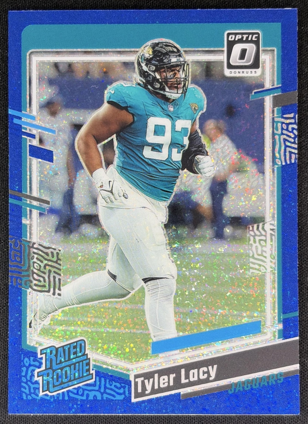 Tyler Lacy 2023 Panini Donruss Optic Blue Glitter Prizm Jaguars front