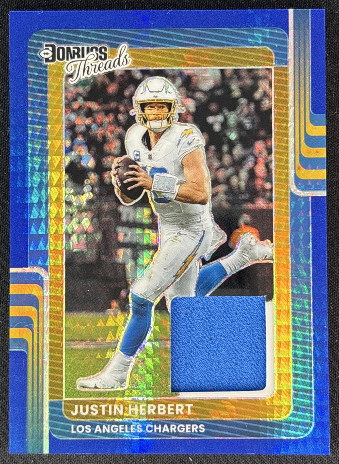 Justin Herbert 2025 Panini Donruss Optic Threads Blue Hyper Prizm Chargers front