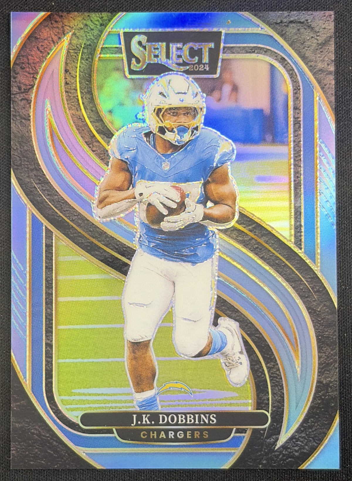 J.K. Dobbins 2024 Panini Select Premier Light Blue Prizm /99 Chargers Sports Trading Card