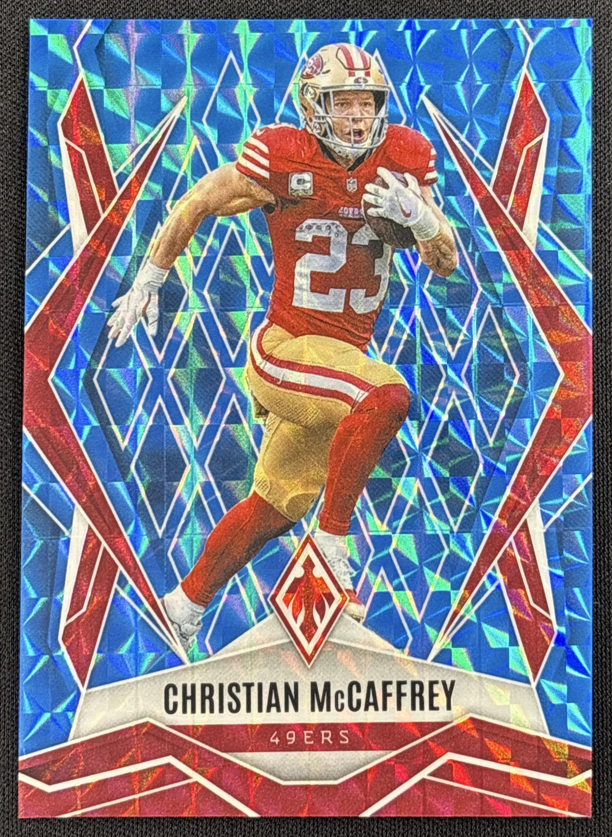 Christian McCaffrey 2025 Panini Phoenix Light Blue Pyramids Prizm /385 49ers