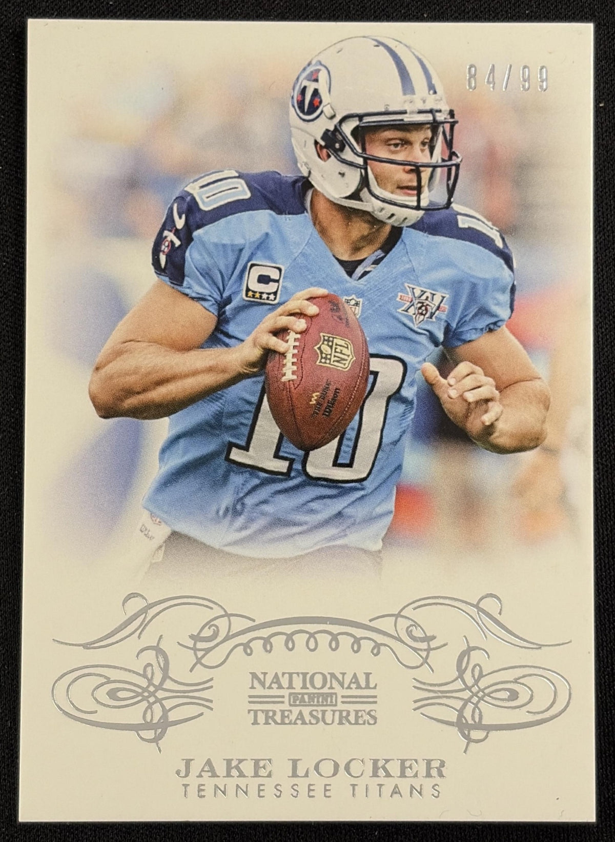 Front of Jake Locker 2013 Panini National Treasures /99 Titans sports trading card