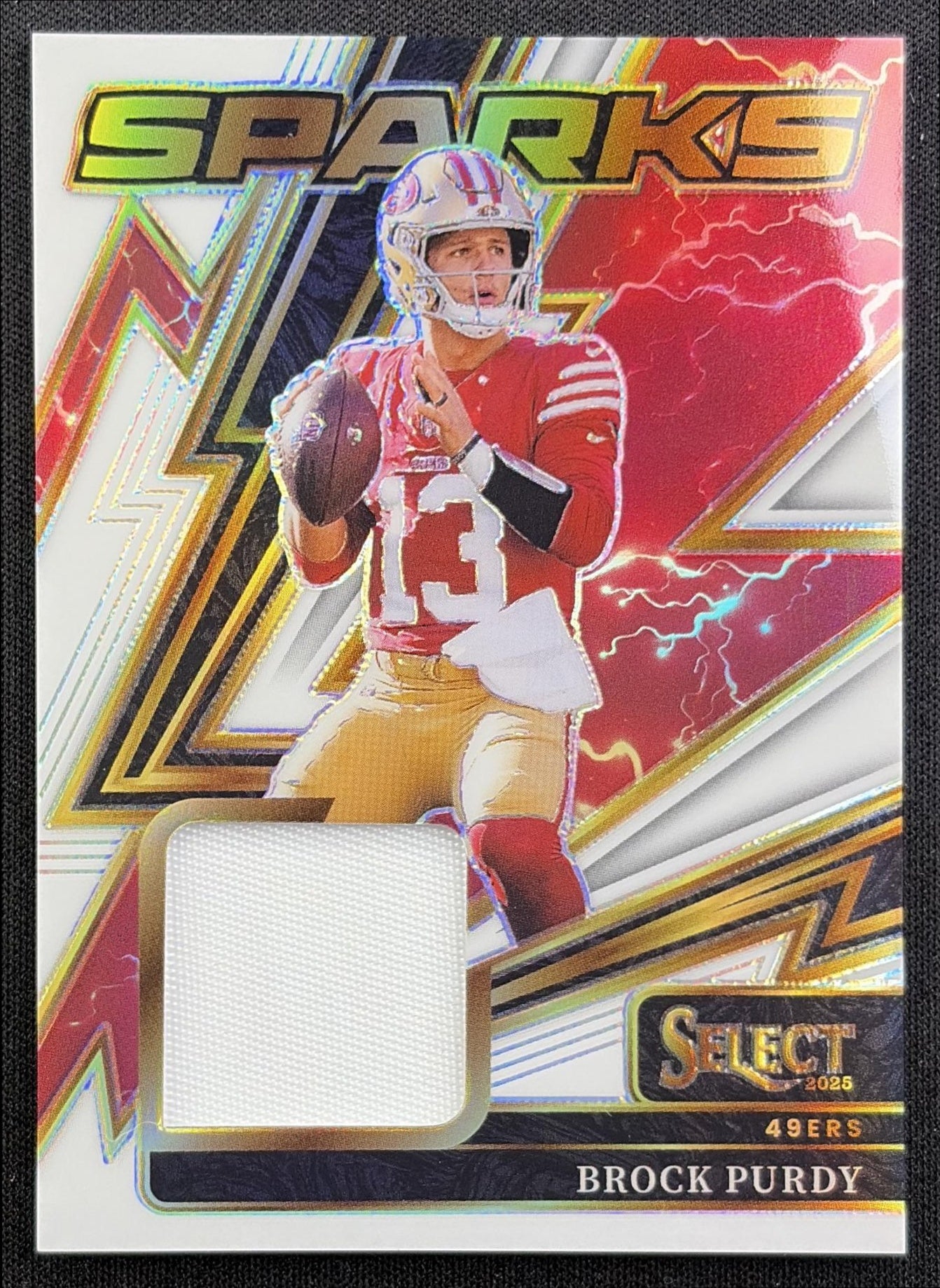 Brock Purdy 2025 Panini Select Sparks White Prizm /99 49ers