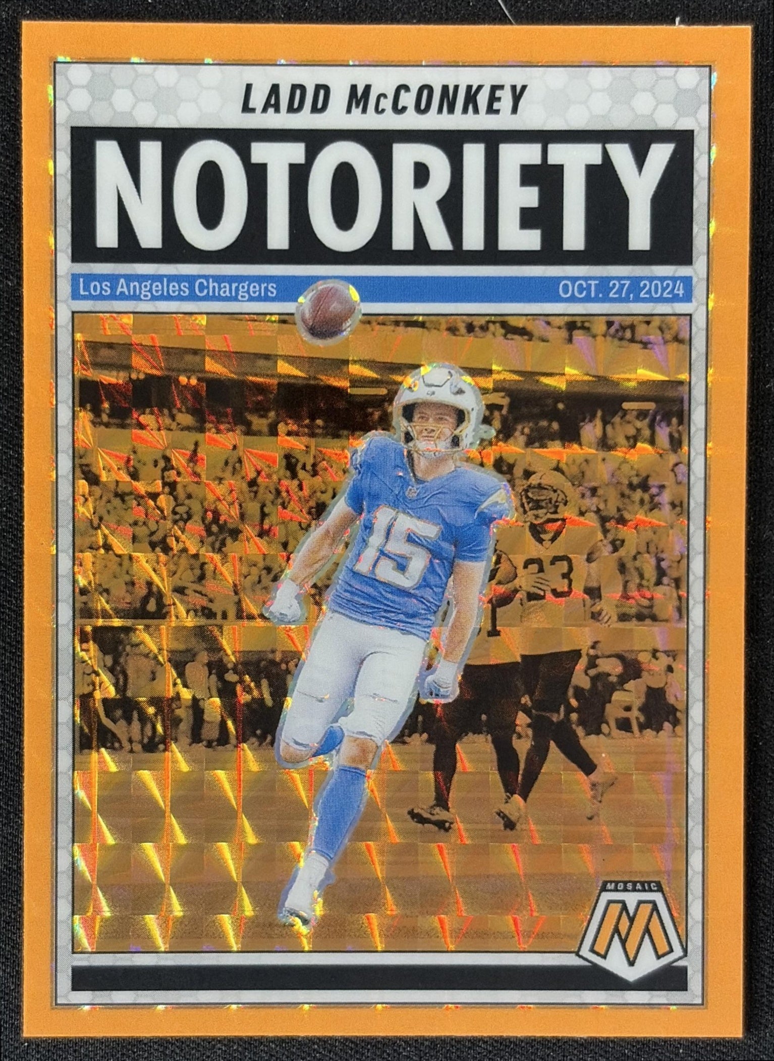 Ladd McConkey 2025 Panini Mosaic Notoriety Orange Fluorescent Prizm Chargers front