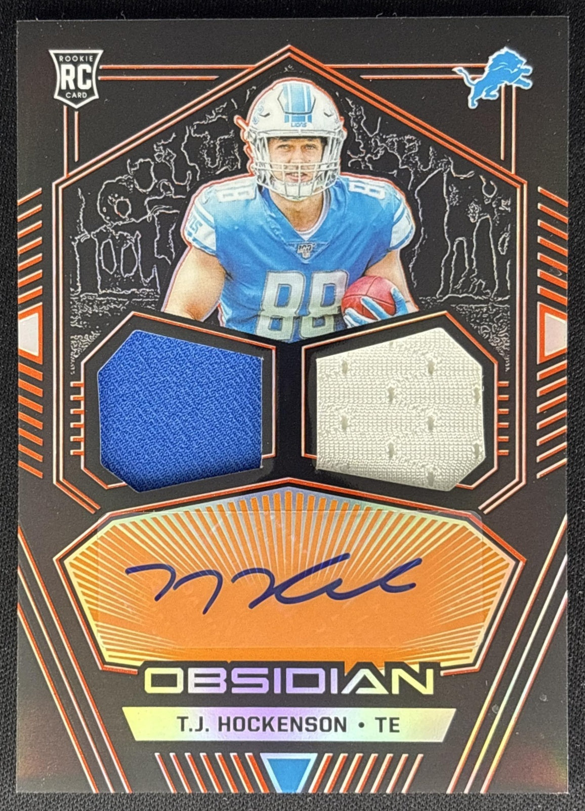 T.J. Hockenson 2019 Obsidian Rookie Jersey Ink Electric Etch Orange /75 Lions front