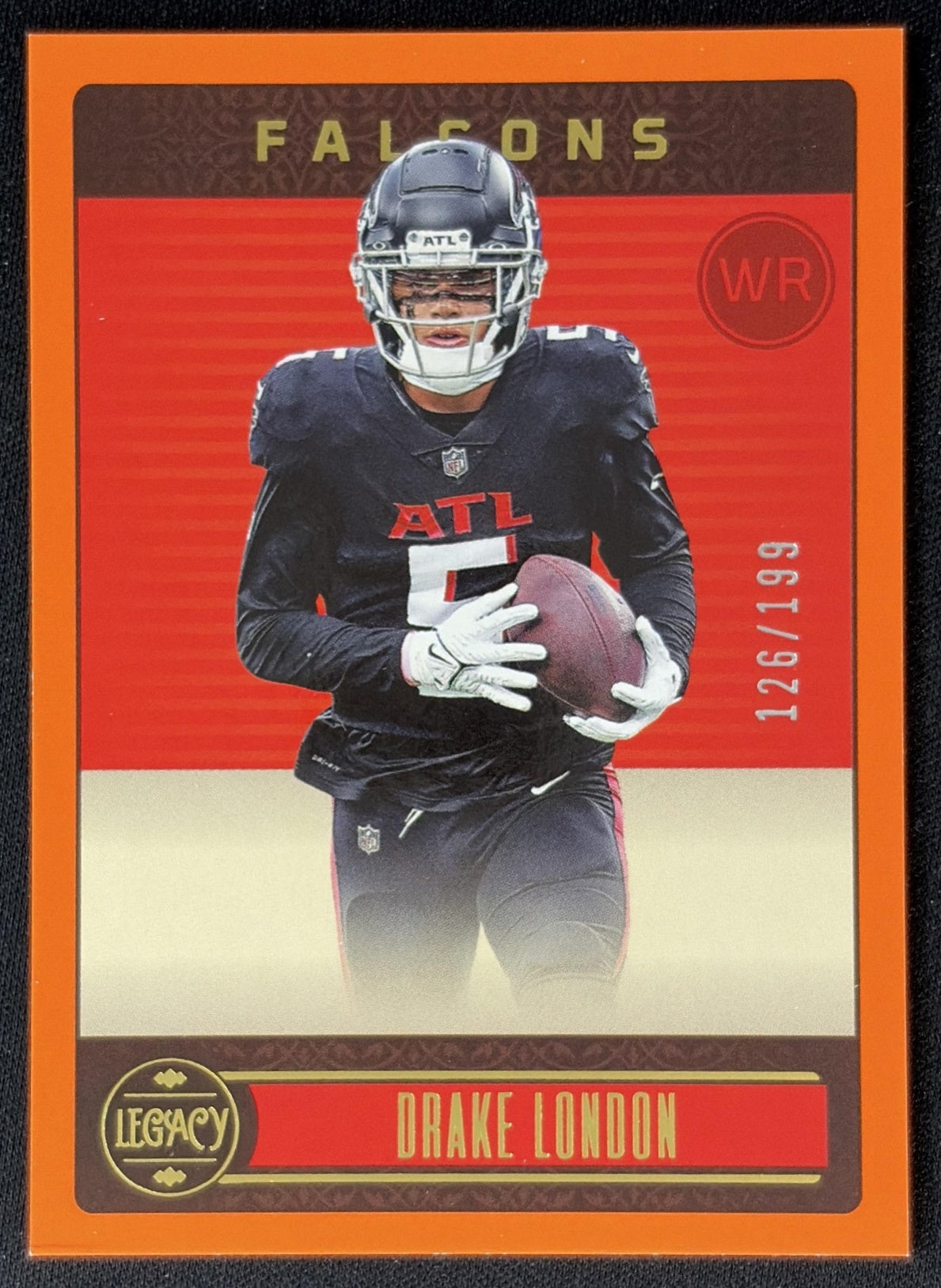 Drake London 2023 Panini Legacy Orange /199 Falcons front