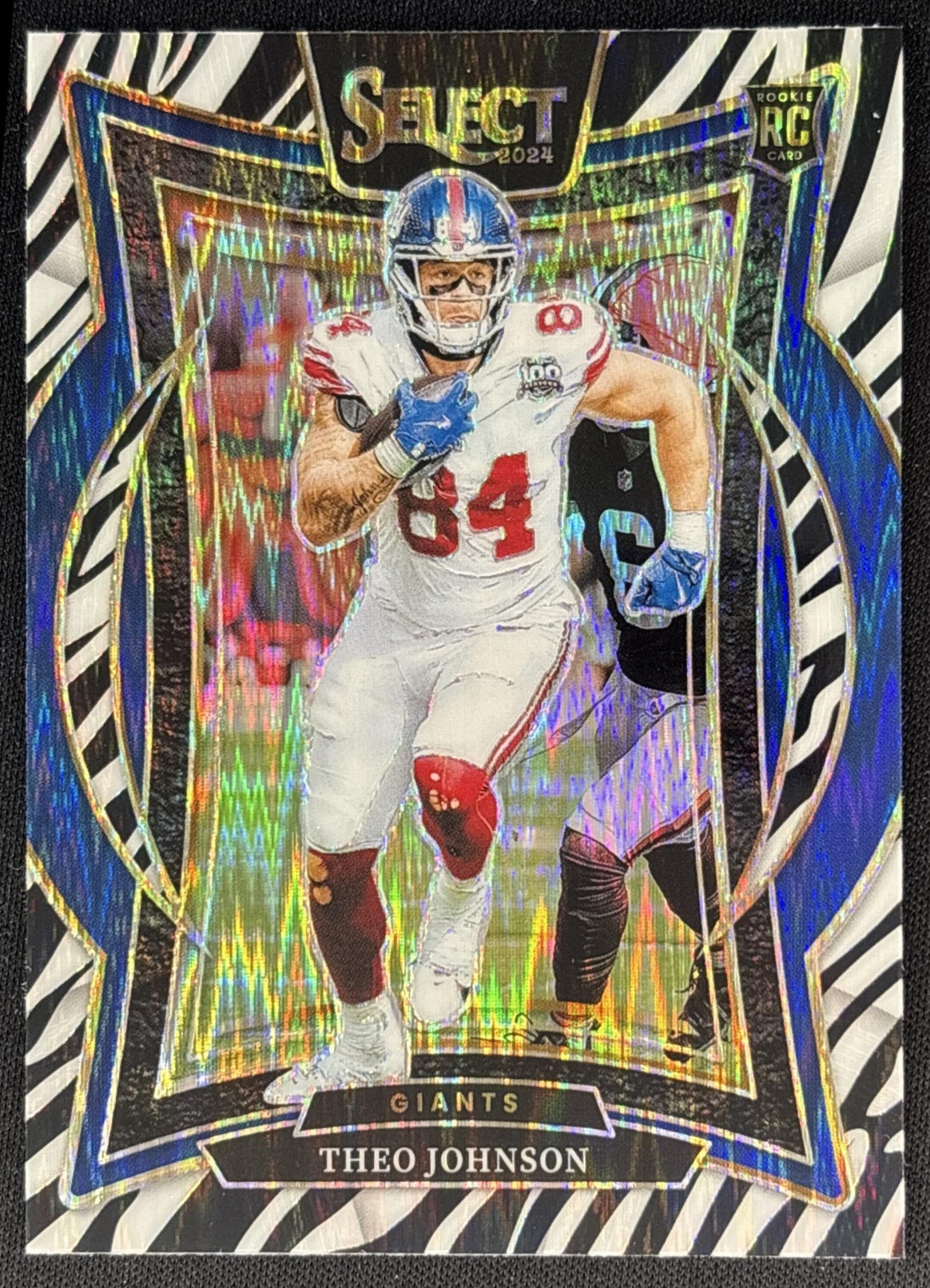 Theo Johnson 2024 Panini Select Concourse Zebra Prizm Shock Giants